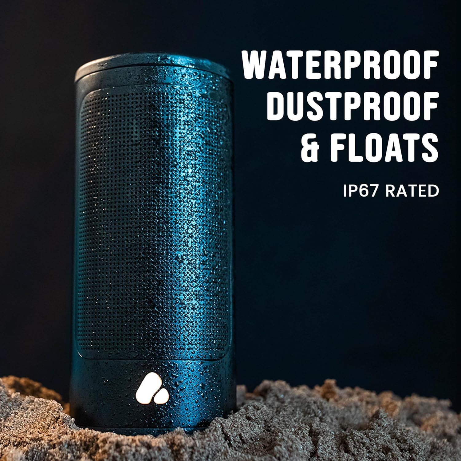 Haut-parleur cylindrique bleu étanche, anti-poussière et flottant dans le sable.