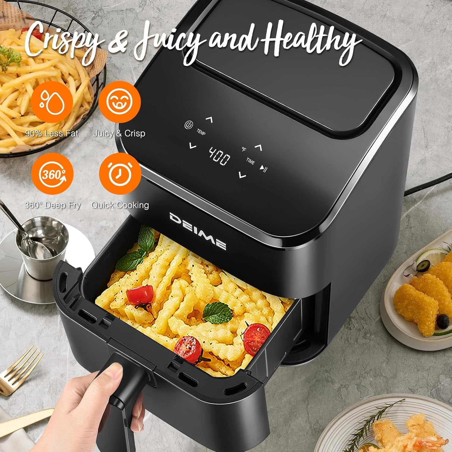 Une friteuse à air noire DEIME avec un tiroir ouvert montrant des frites et des tomates.