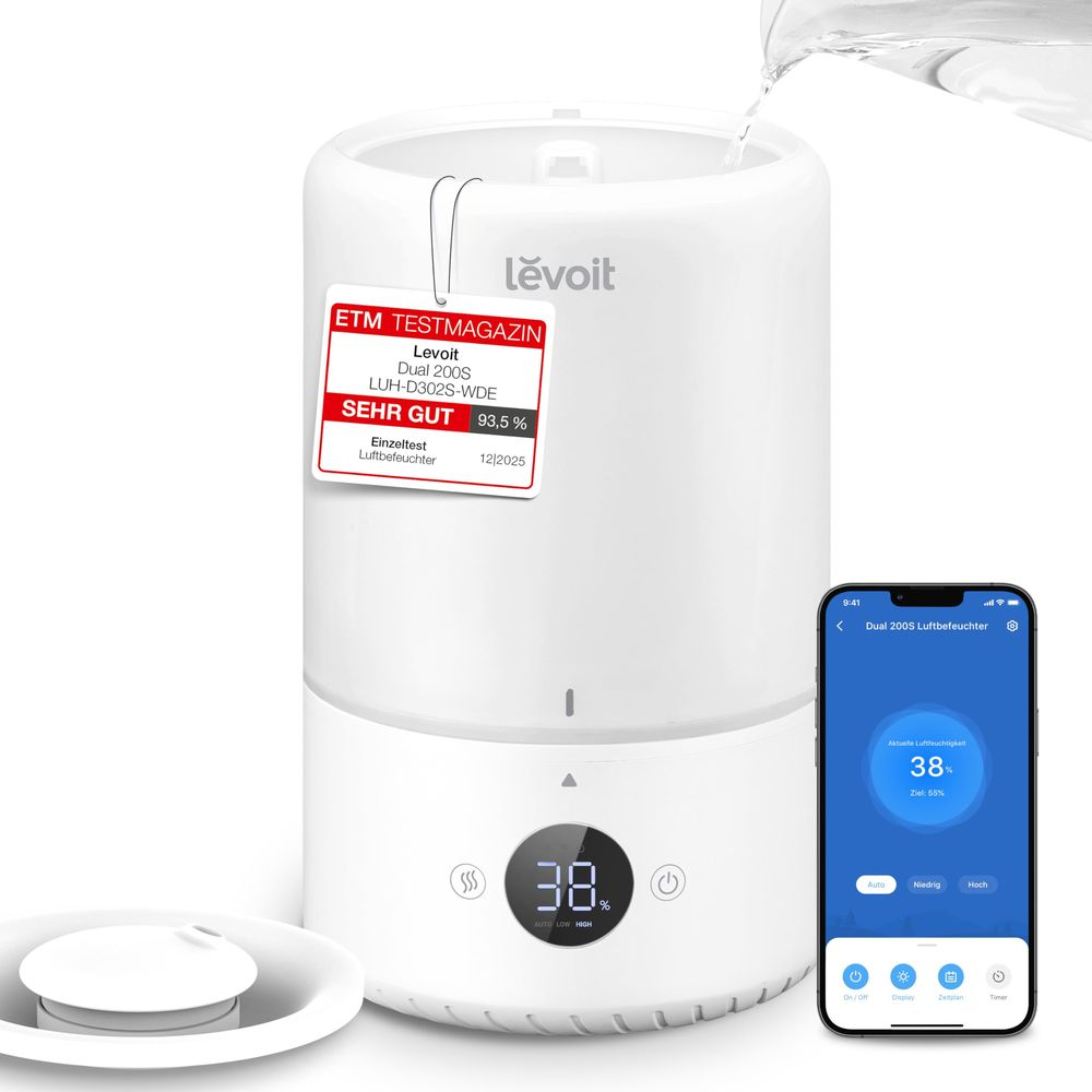 Umidificatore Levoit bianco riempito d'acqua, accanto a uno smartphone con app e a un coperchio separato.