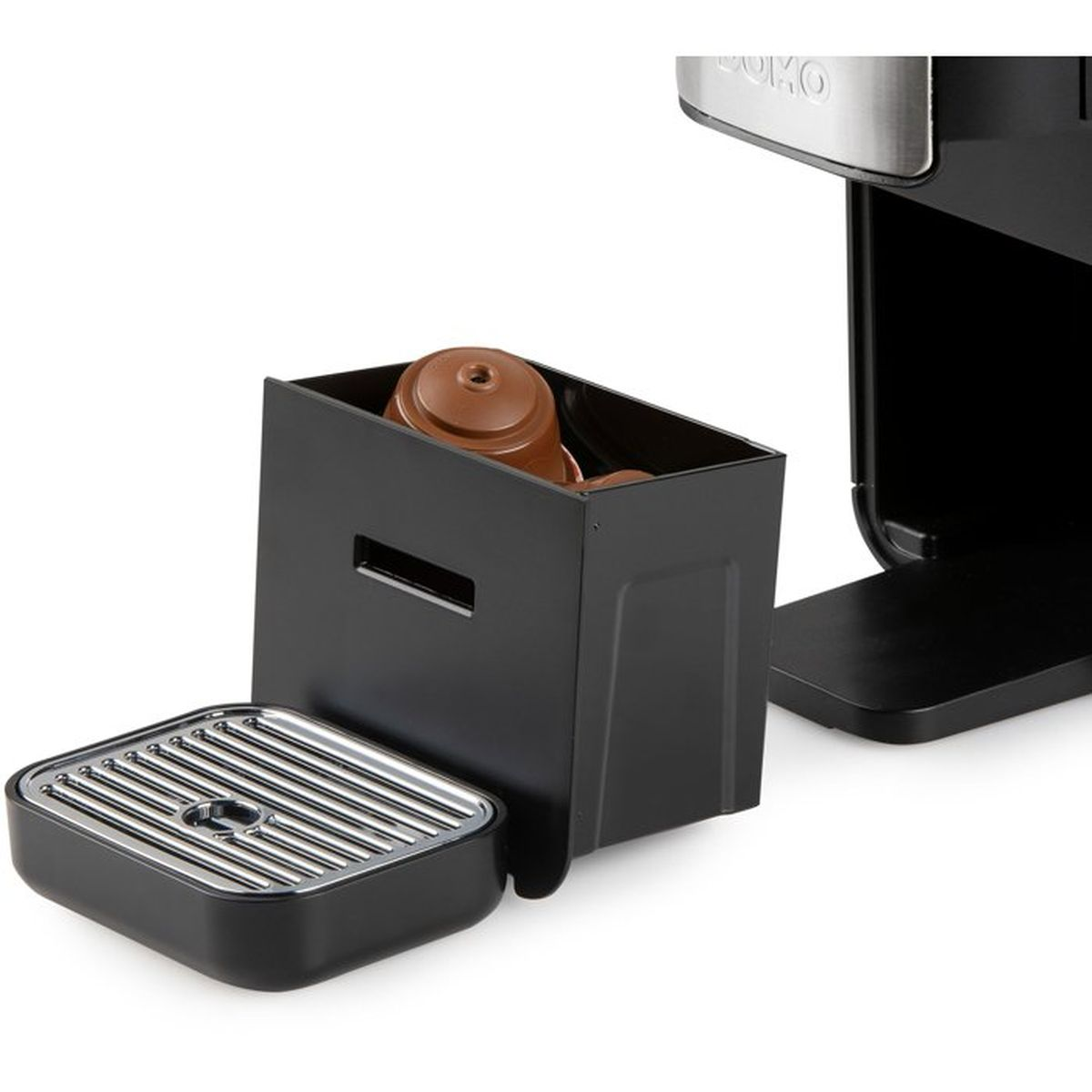 Kaffeemaschine mit abnehmbarem Kapselbehälter und Tropfschale.