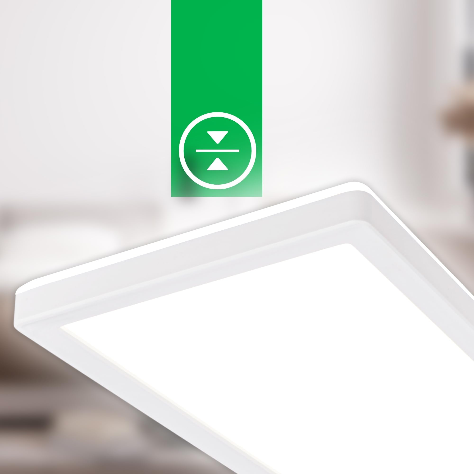 Una lampada a pannello LED bianca con un simbolo verde di regolazione dell'altezza, su sfondo sfocato.