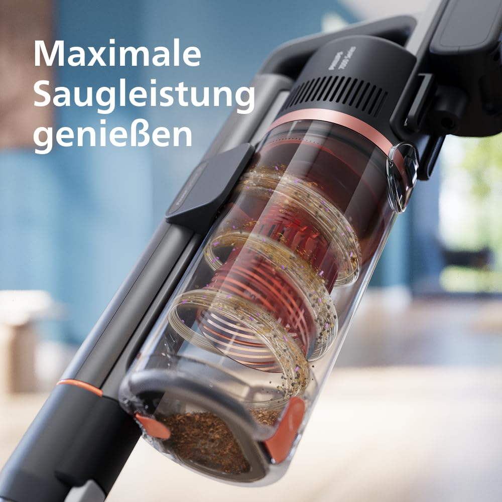 Nahaufnahme eines Staubsaugers mit transparentem Staubbehälter, in dem Schmutz wirbelt, mit Text.