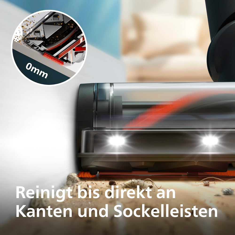 Ein Staubsaugerkopf mit Lichtern reinigt nah an der Fußleiste, mit einem Einsatz, der 0 mm Kantenreinigung zeigt.