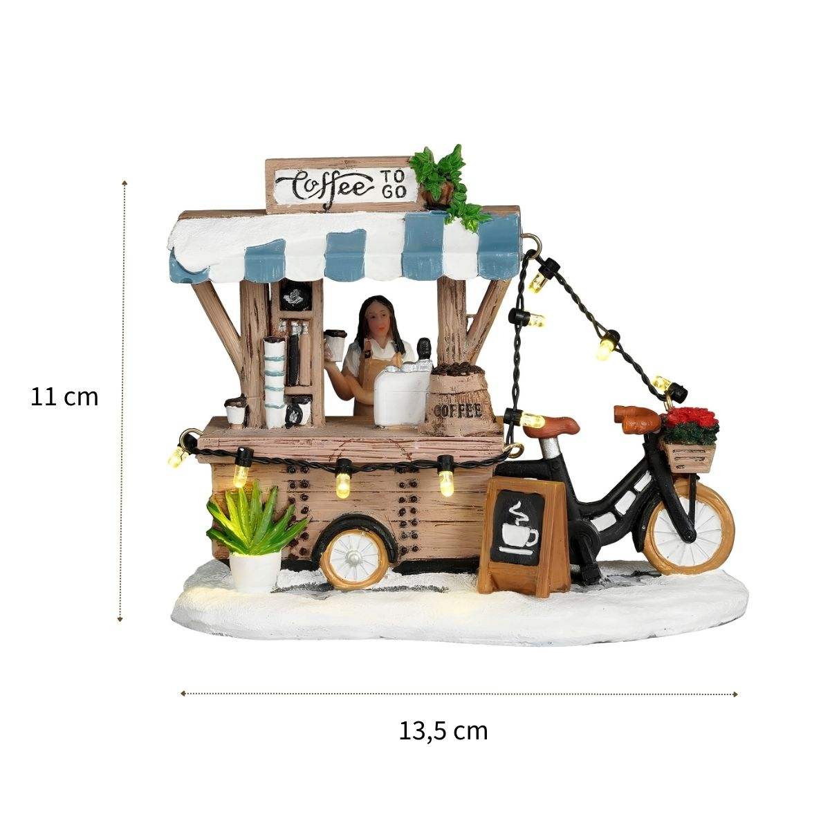 Een miniatuur koffiekraam met barista, verlichting en een zwarte fiets met bloemenmand.