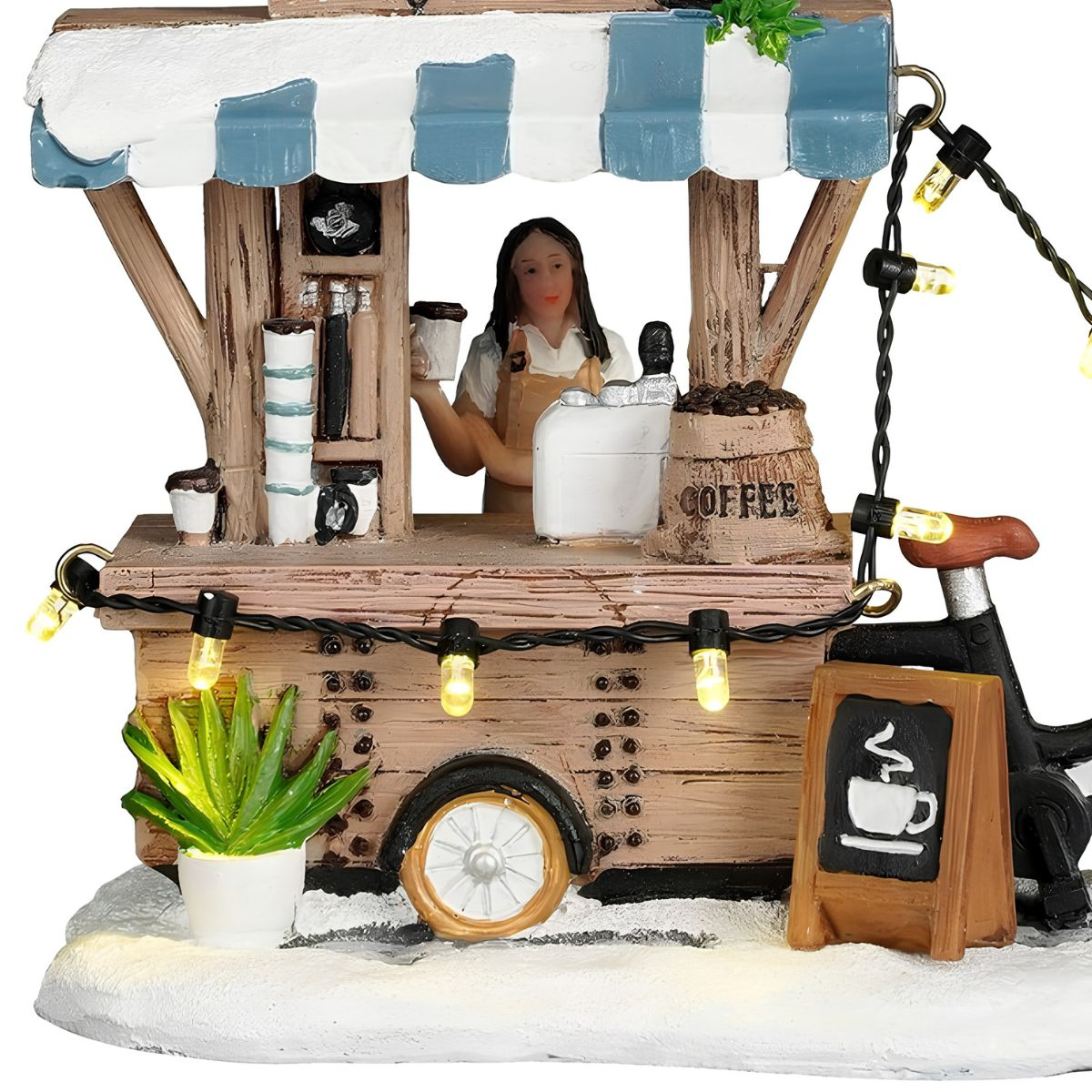Miniatuur koffiekraam met verkoper, blauwe luifel, sfeerverlichting, koffiezak en bord in sneeuw.
