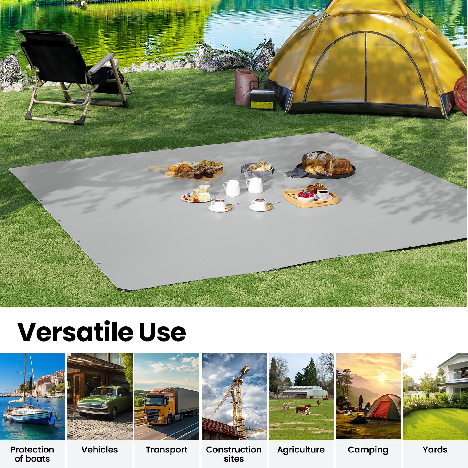 Ein graues Zelt, eine Isomatte mit Picknick und Stühle im Gras am Wasser.