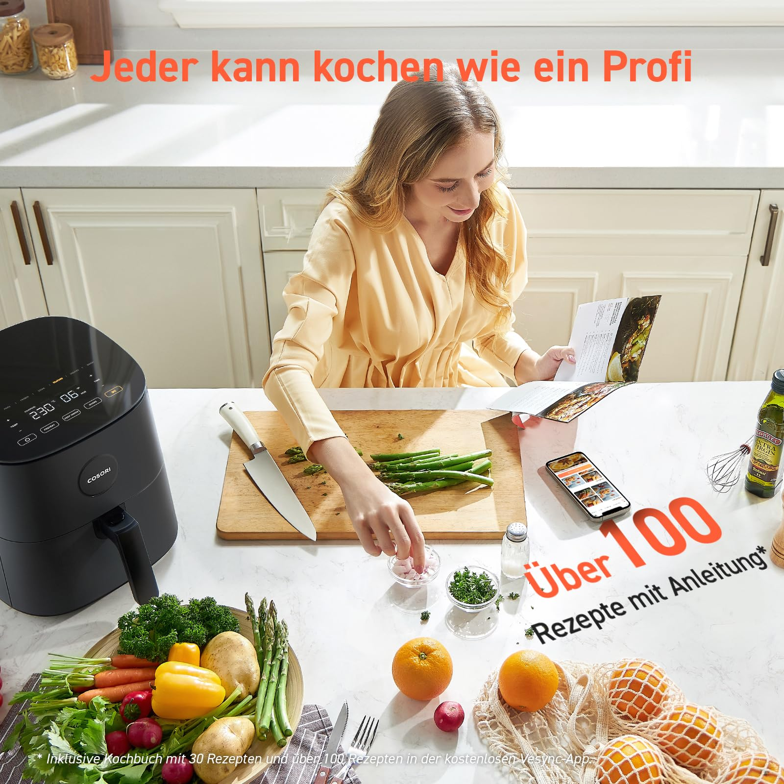 Une femme dans une cuisine prépare des légumes à côté d'une friteuse à air noire.