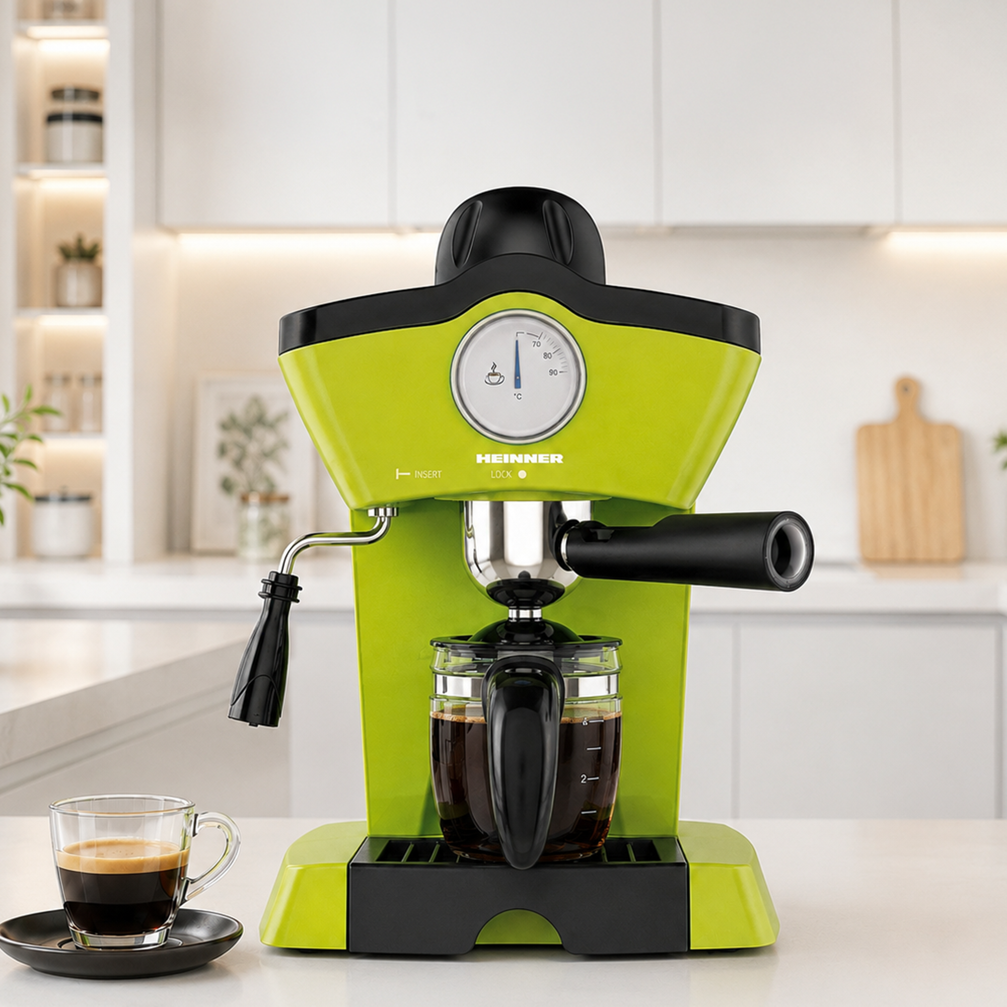 A bright green espresso machine on a white counter, with a glass coffee pot and a cup of coffee beside it.