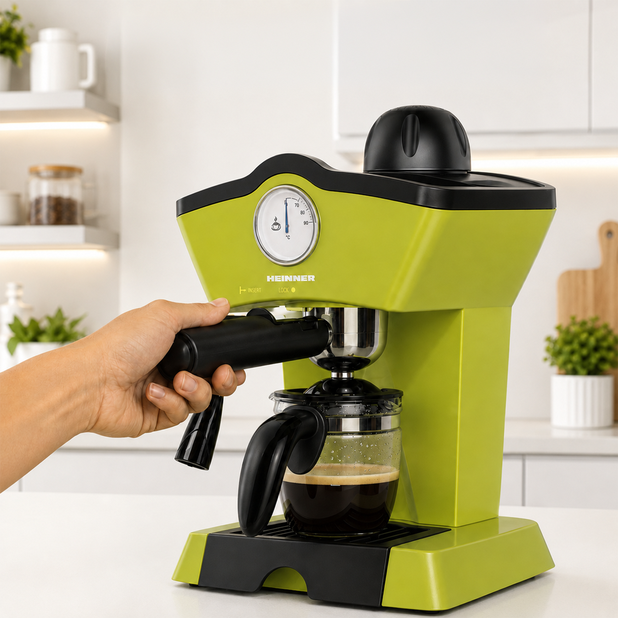 A hand holds the portafilter of a bright green espresso machine in a modern kitchen.