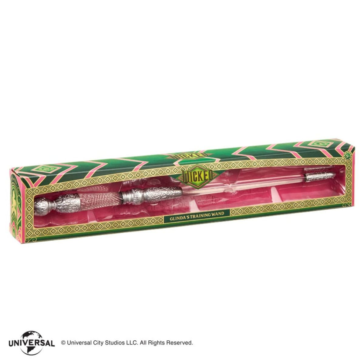 La varita de entrenamiento de Glinda en su caja verde y rosa con detalles intrincados.