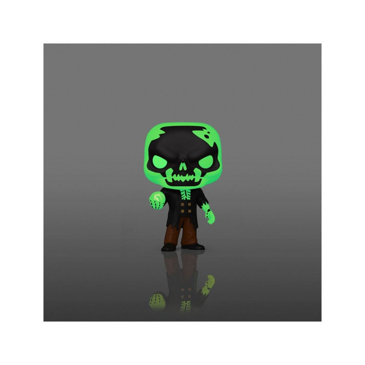 Una figura coleccionable de vinilo con cabeza de esqueleto negro y detalles verdes brillantes sobre un fondo gris.