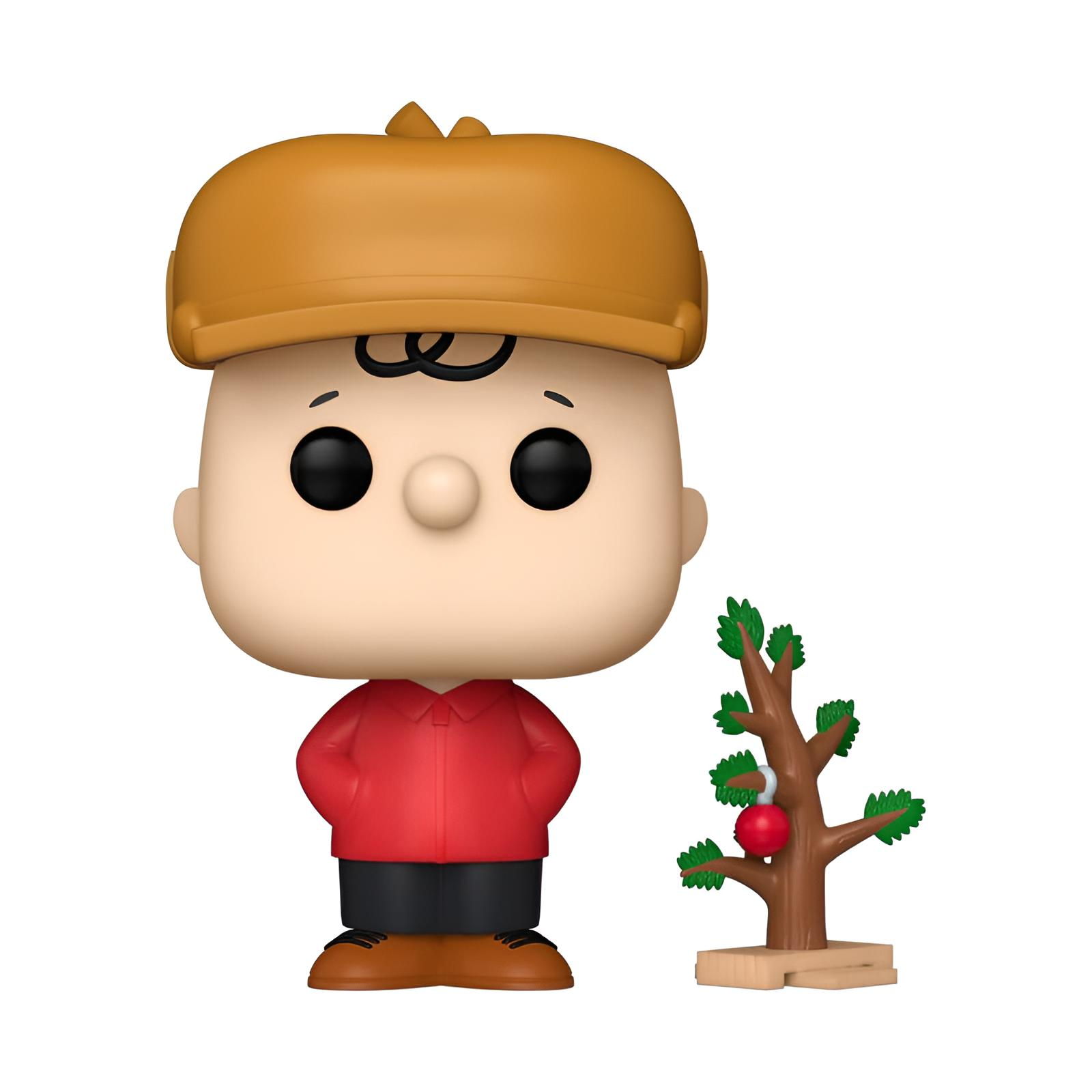 Una figura Funko Pop de Charlie Brown con camisa roja y un pequeño árbol de navidad con una esfera.
