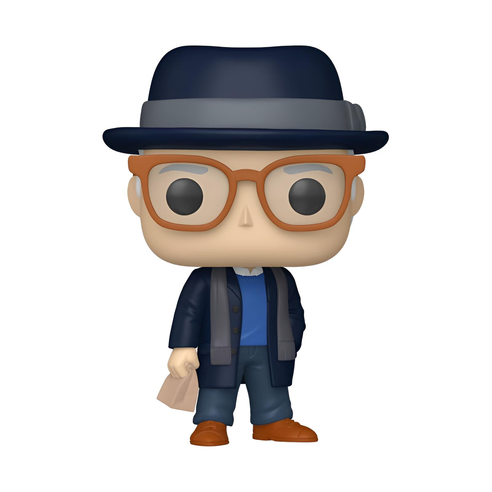 Figura de vinilo con sombrero, gafas grandes, abrigo azul y bufanda, sosteniendo una bolsa de papel.