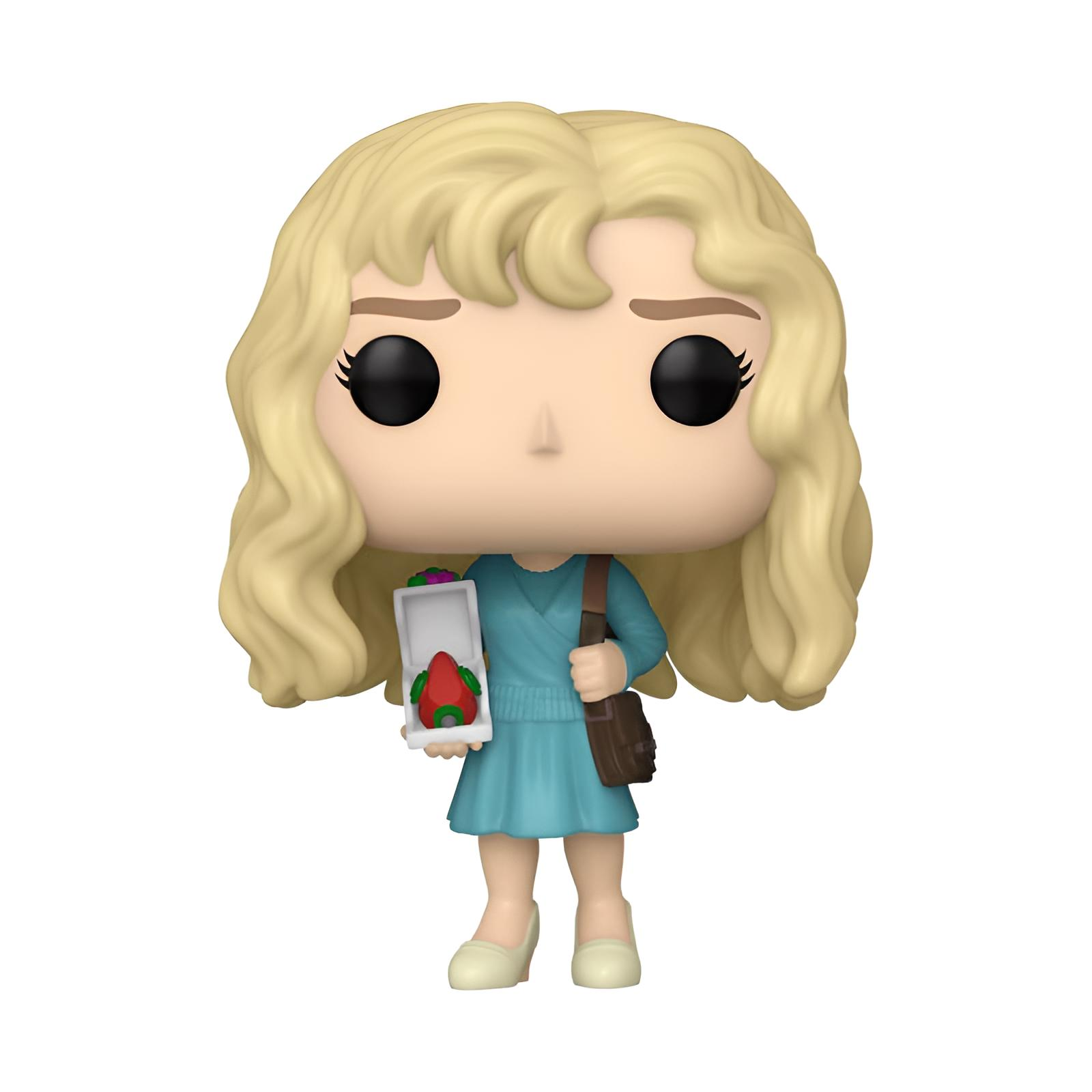 Una figura Funko Pop rubia con vestido azul que sostiene una caja pequeña y un bolso sobre fondo blanco.