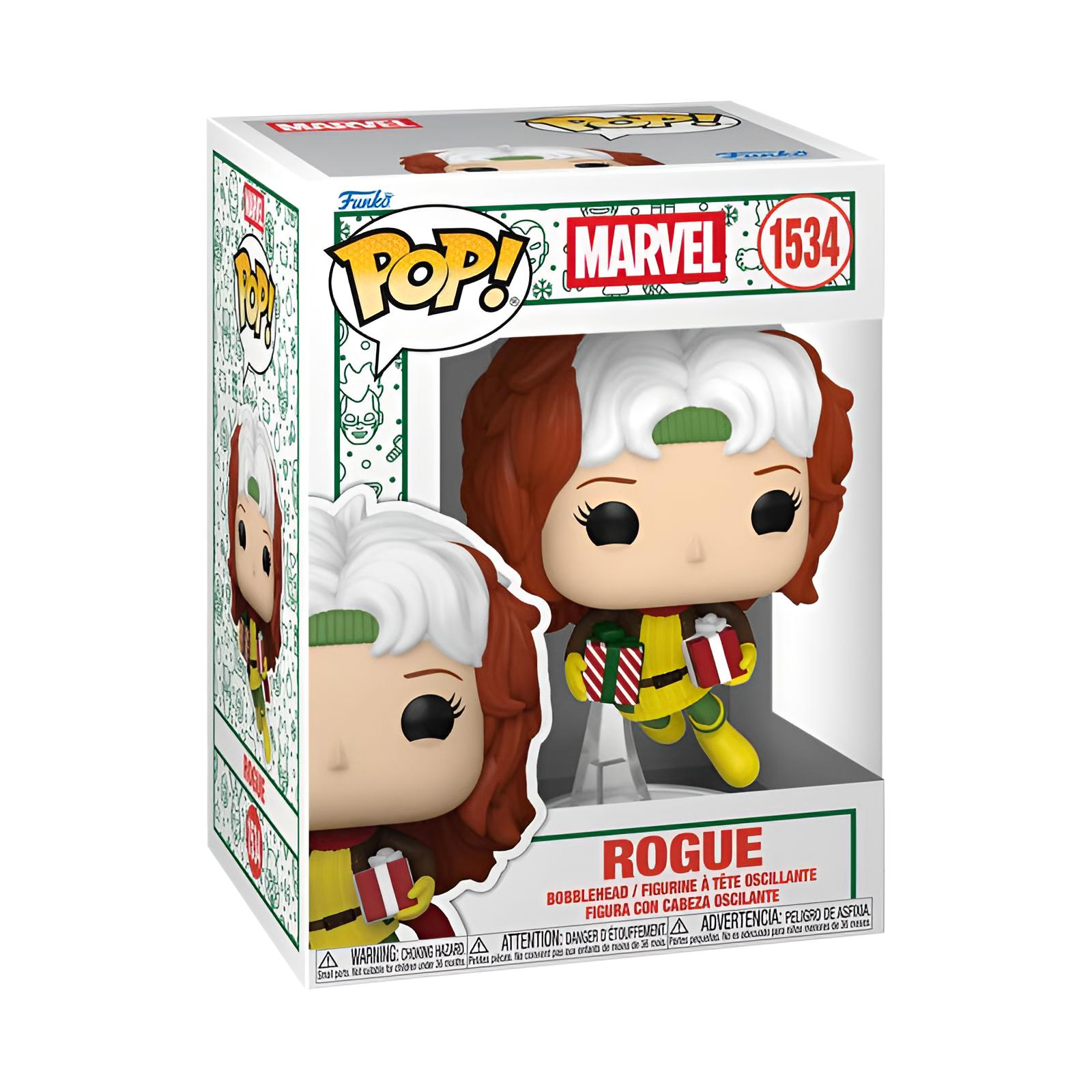 Eine Marvel Rogue Funko Pop Wackelkopf-Figur in ihrer Schachtel mit zwei kleinen Geschenken.