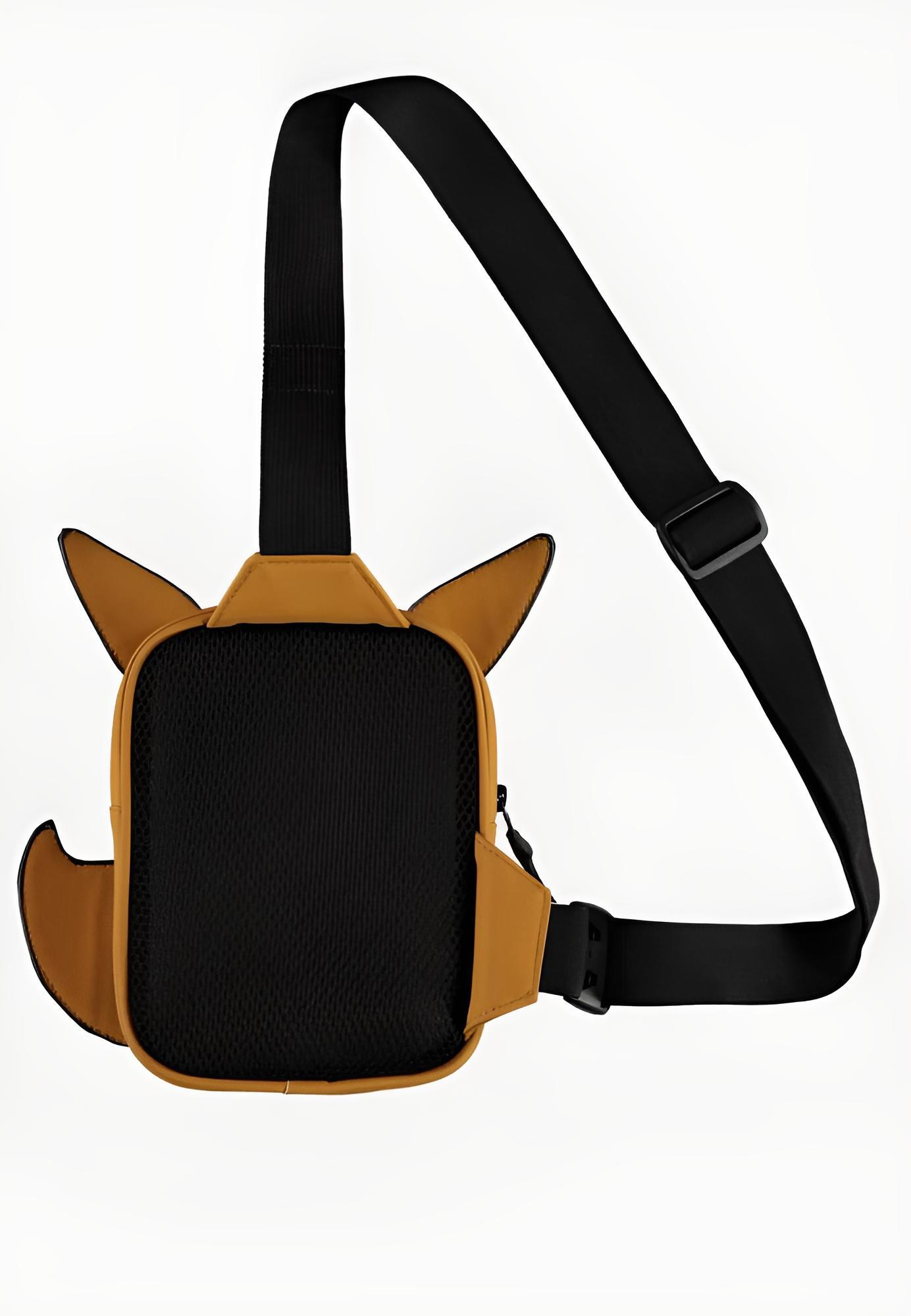 Gelbe Sling-Tasche mit schwarzen Ohren, Schwanz und verstellbarem Gurt vor weißem Hintergrund.