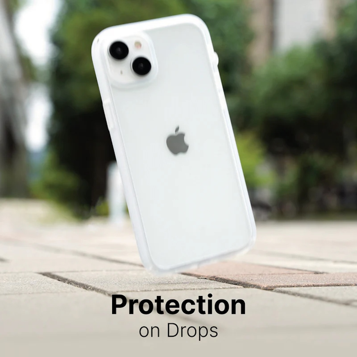 Ein weißes iPhone in Schutzhülle schwebt über Boden mit Text Schutz bei Stürzen.