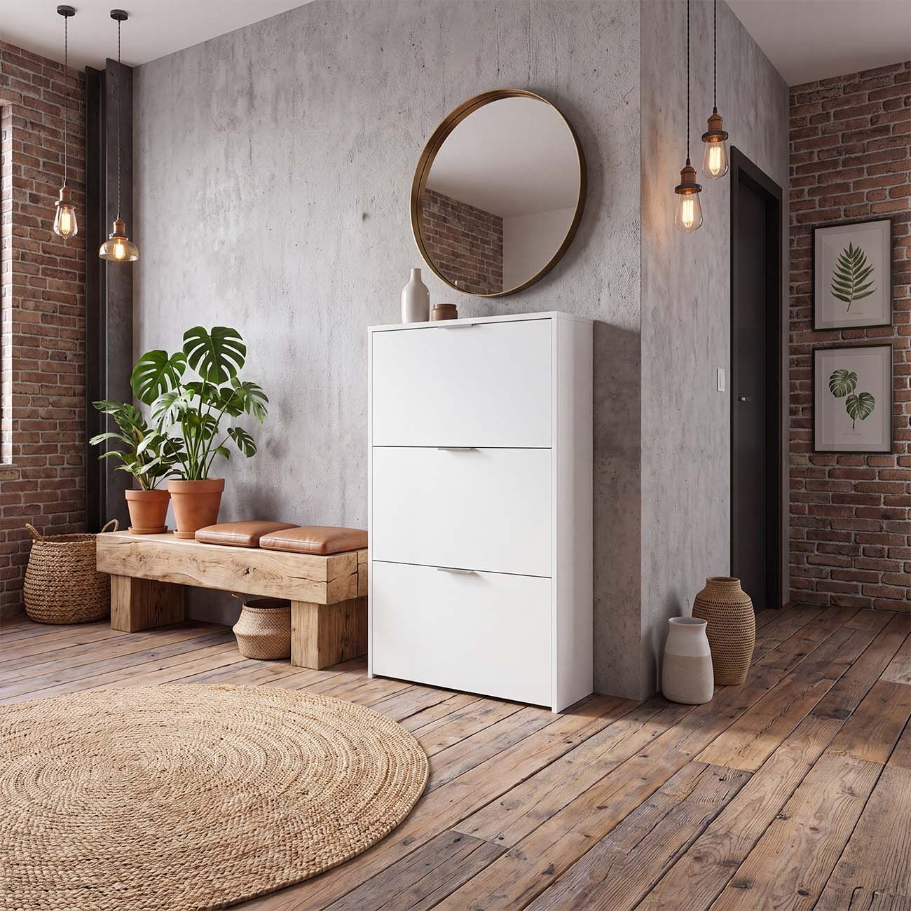 Pasillo moderno con zapatero blanco, espejo redondo, banco de madera y plantas ante paredes de hormigón y ladrillo.