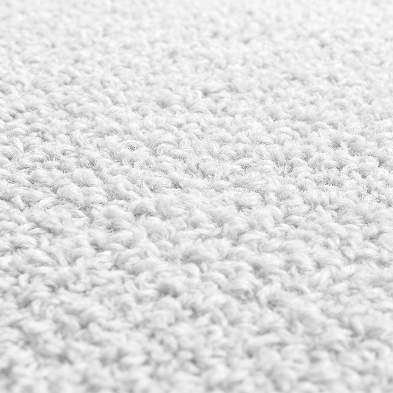 Primer plano de textura blanca con fibras tejidas.