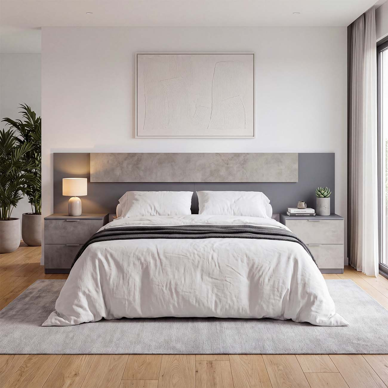 Dormitorio moderno con cama blanca, mesitas de noche grises, cuadro y lámpara.