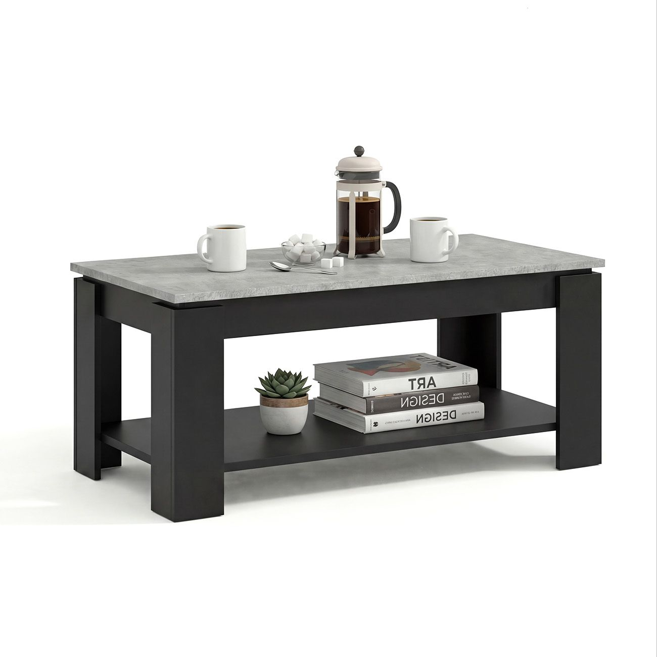 Una mesa de centro negra con tapa de hormigón gris tiene una cafetera, tazas, azúcar y libros.