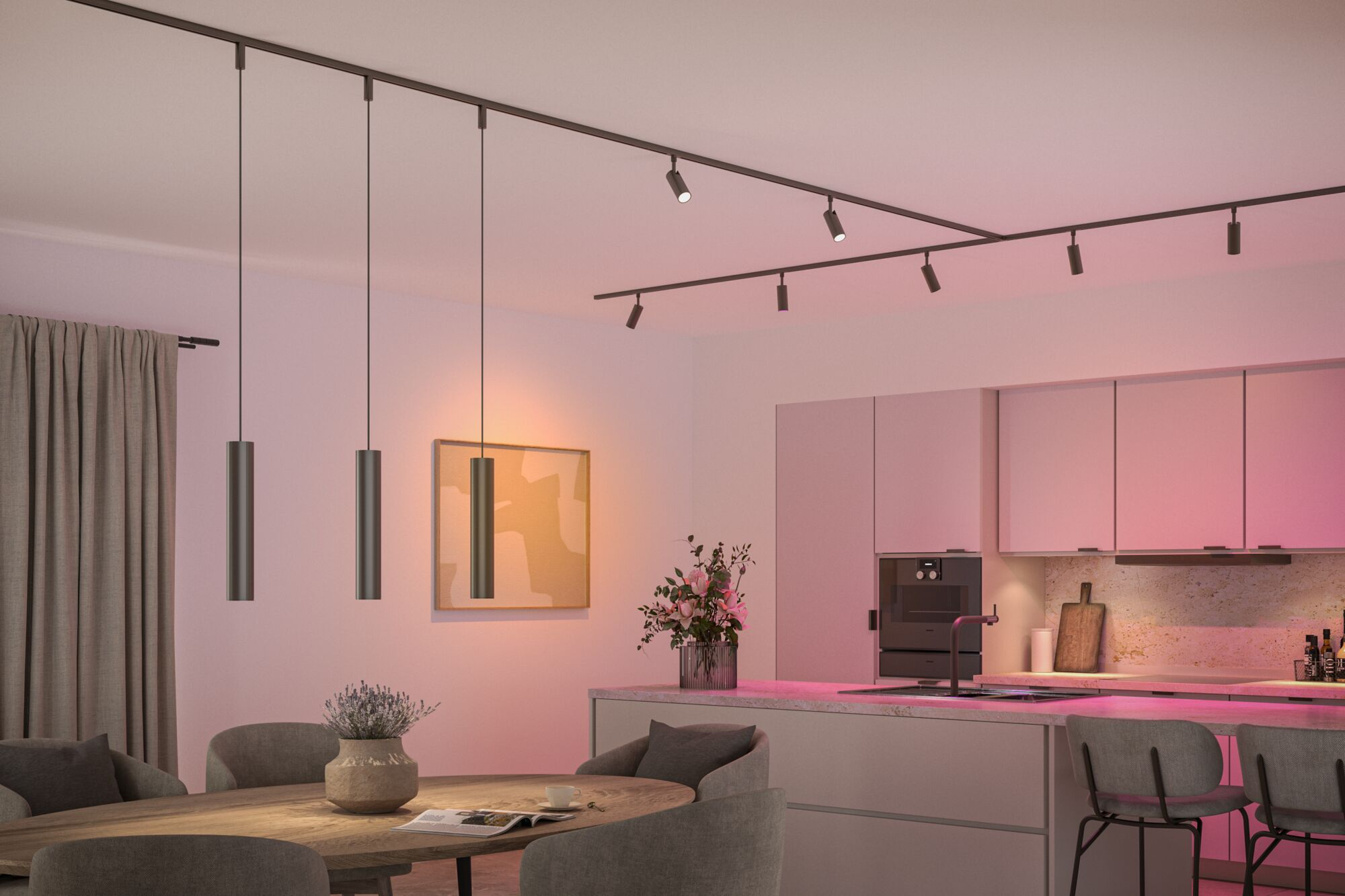 Moderne Küche und Essbereich mit Pendelleuchten und rosa Lichtakzenten.