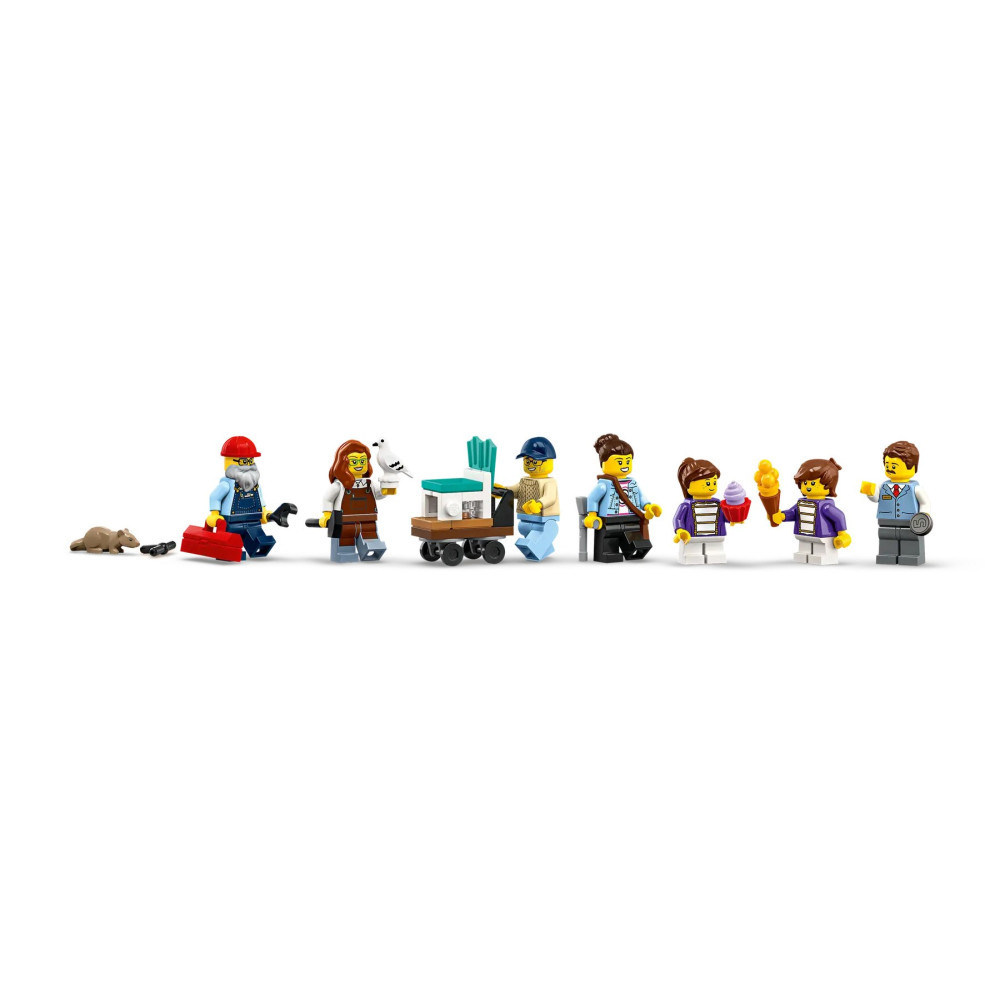 Rząd minifigurek Lego przedstawiający robotników, dzieci, psa i wózek na białym tle.