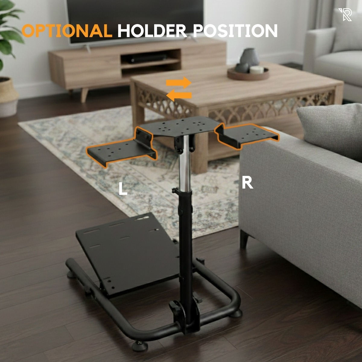 Un soporte para juegos negro con soportes ajustables se encuentra frente a un sofá gris en una sala de estar.