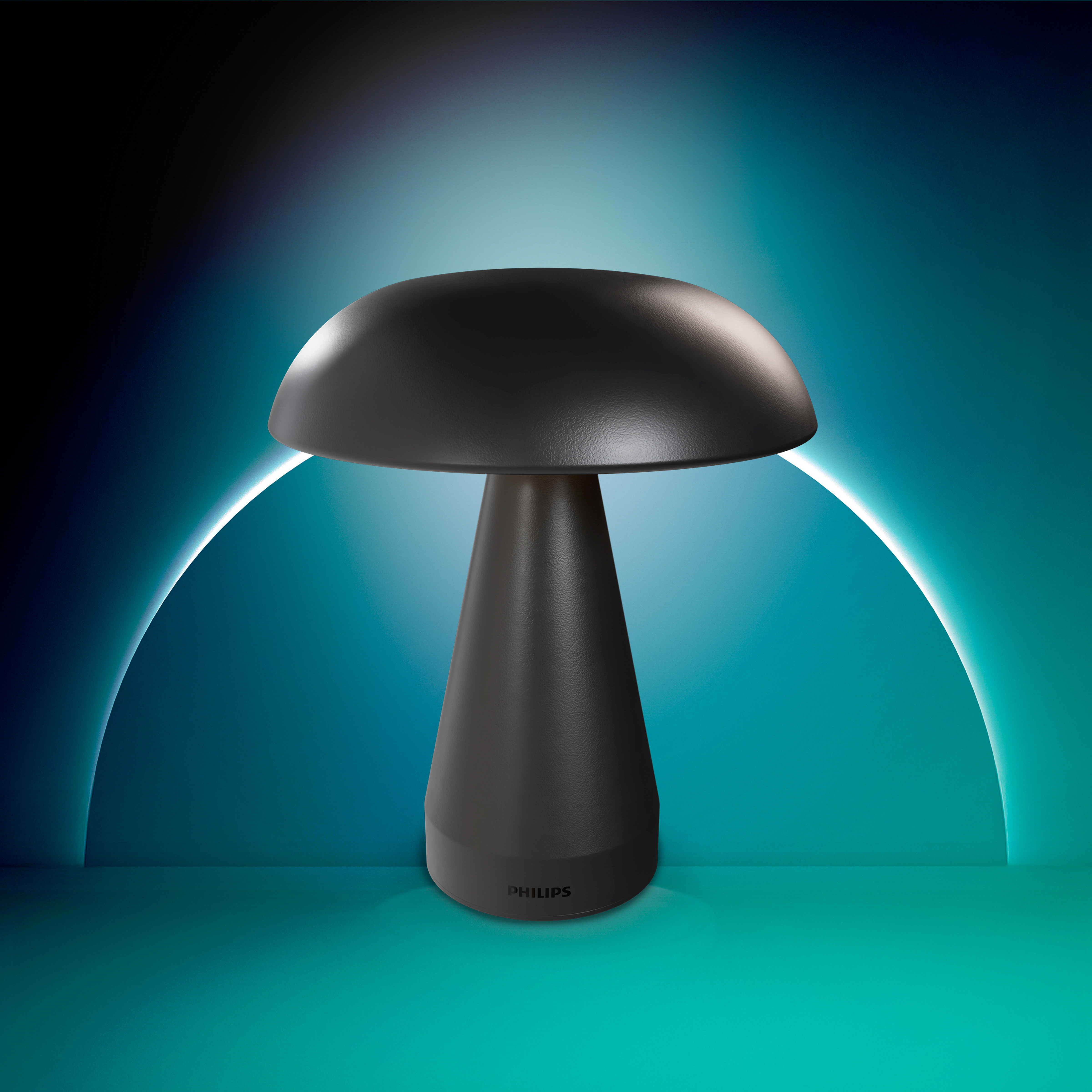 Een zwarte Philips paddestoelvormige tafellamp op een turquoise oppervlak met een blauwe boog.