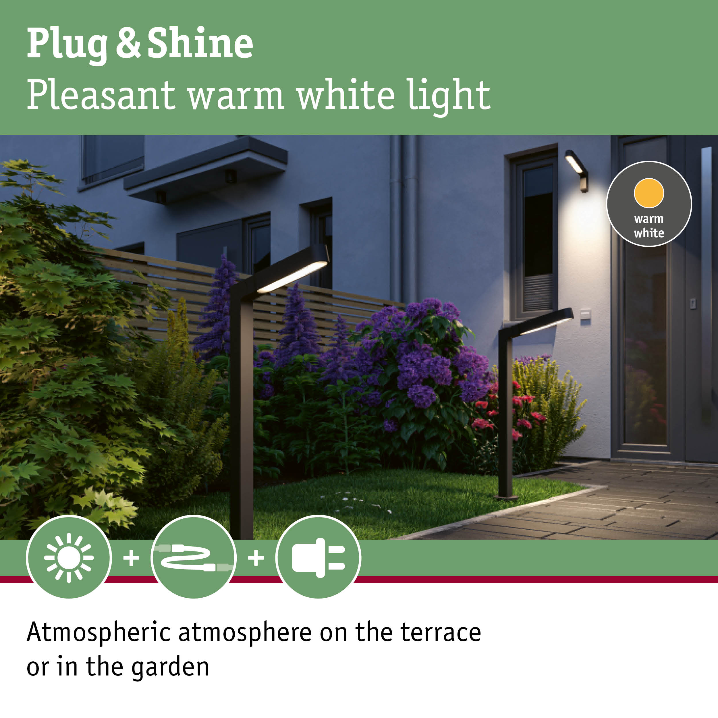 Moderne Wegeleuchten beleuchten abends einen Garten vor einem grauen Haus mit Blumen.