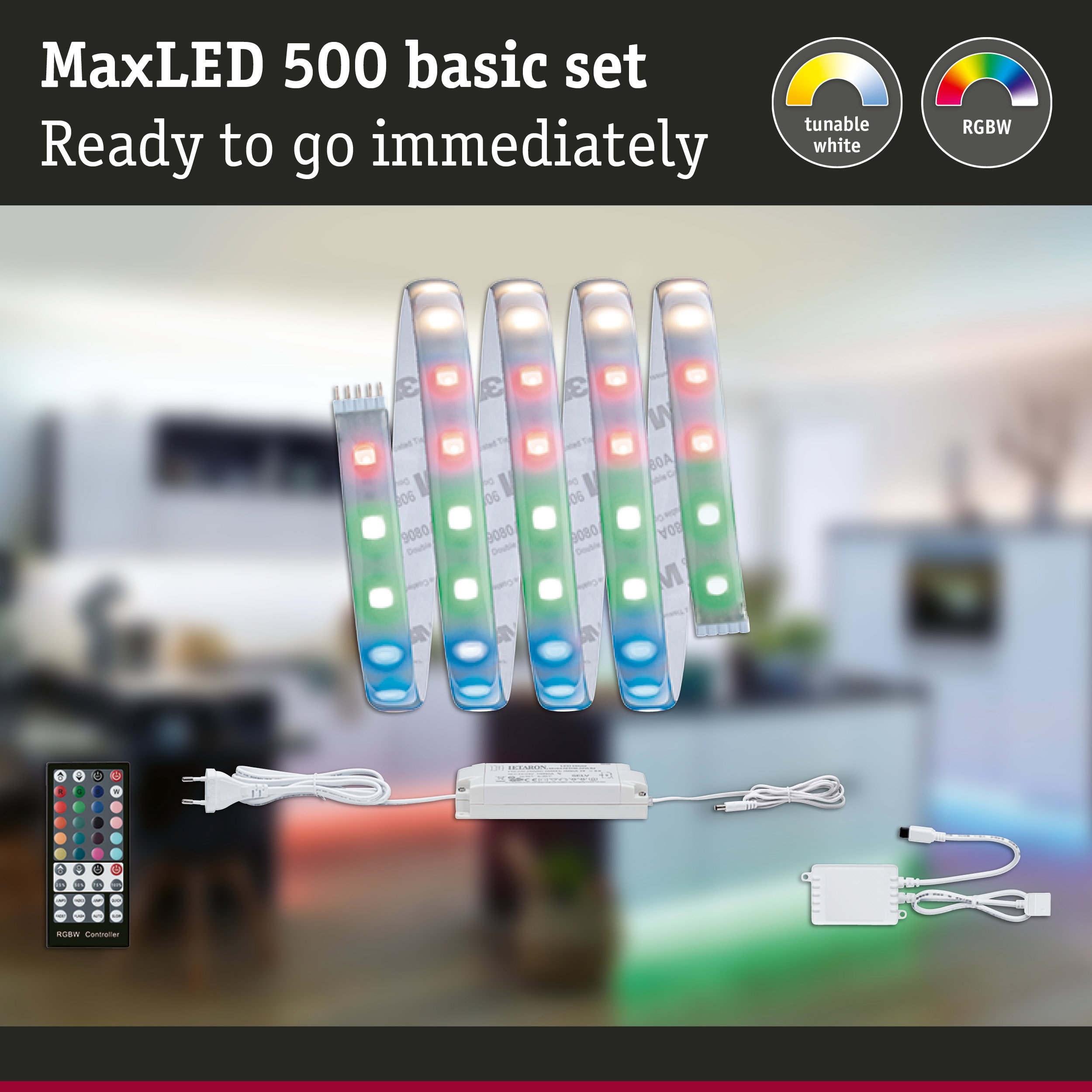 MaxLED 500 Basis-Set mit LED-Streifen, Fernbedienung, Netzteil und Controller vor unscharfem Raumhintergrund.