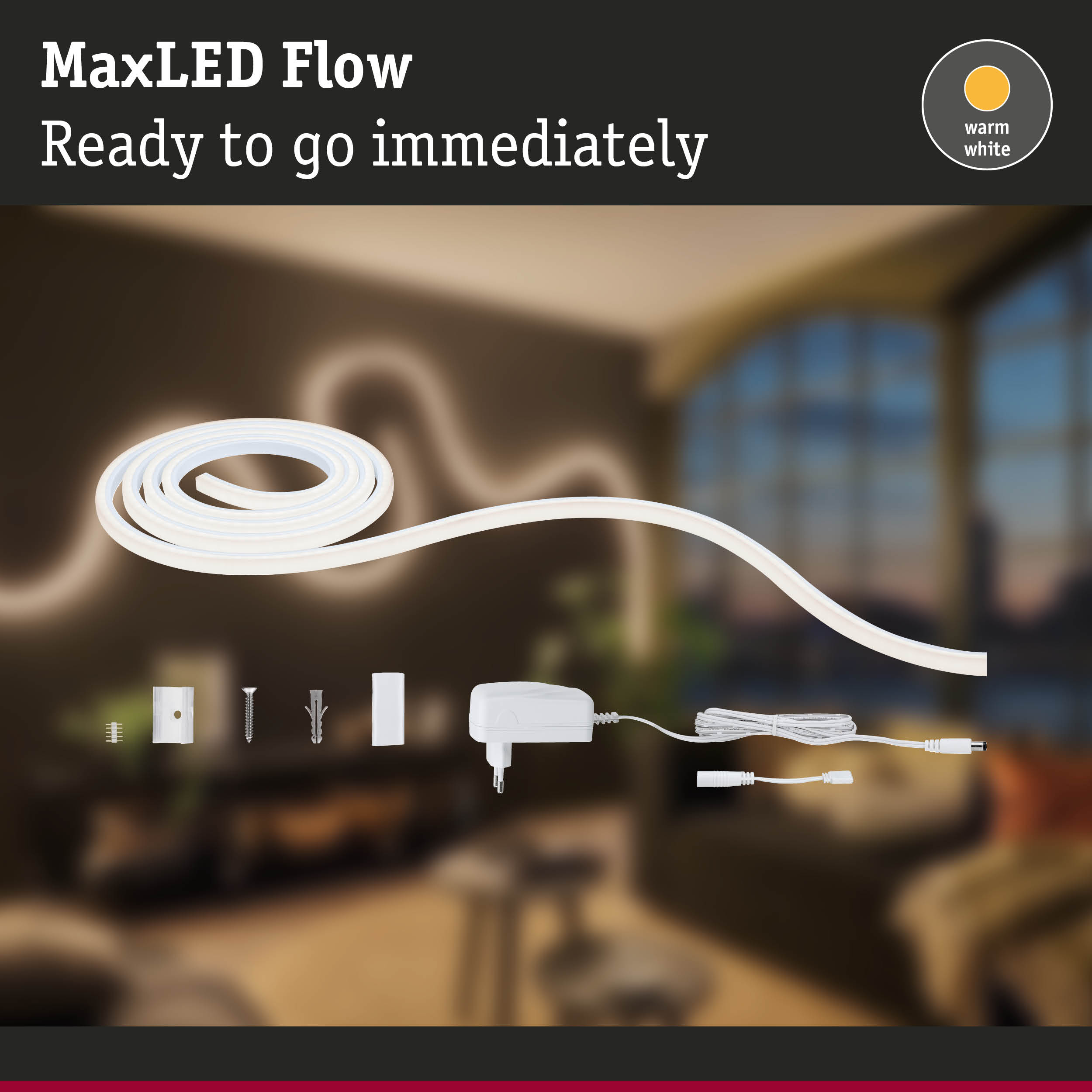 MaxLED Flow LED-Streifen Set mit Zubehör vor verschwommenem Raum.