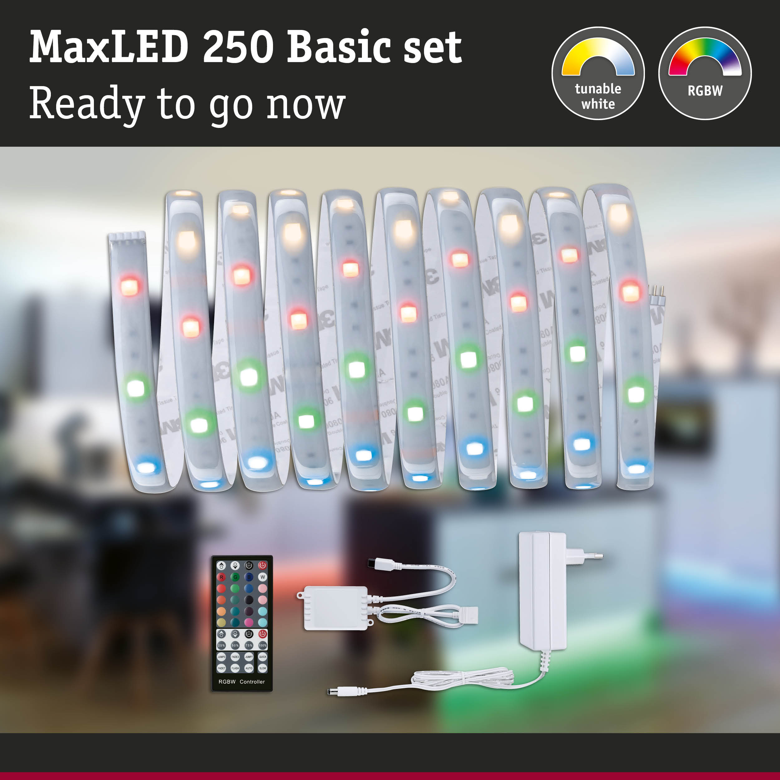 MaxLED 250 Basisset mit LED-Streifen, Fernbedienung, Controller und Netzteil vor verschwommenem Hintergrund.