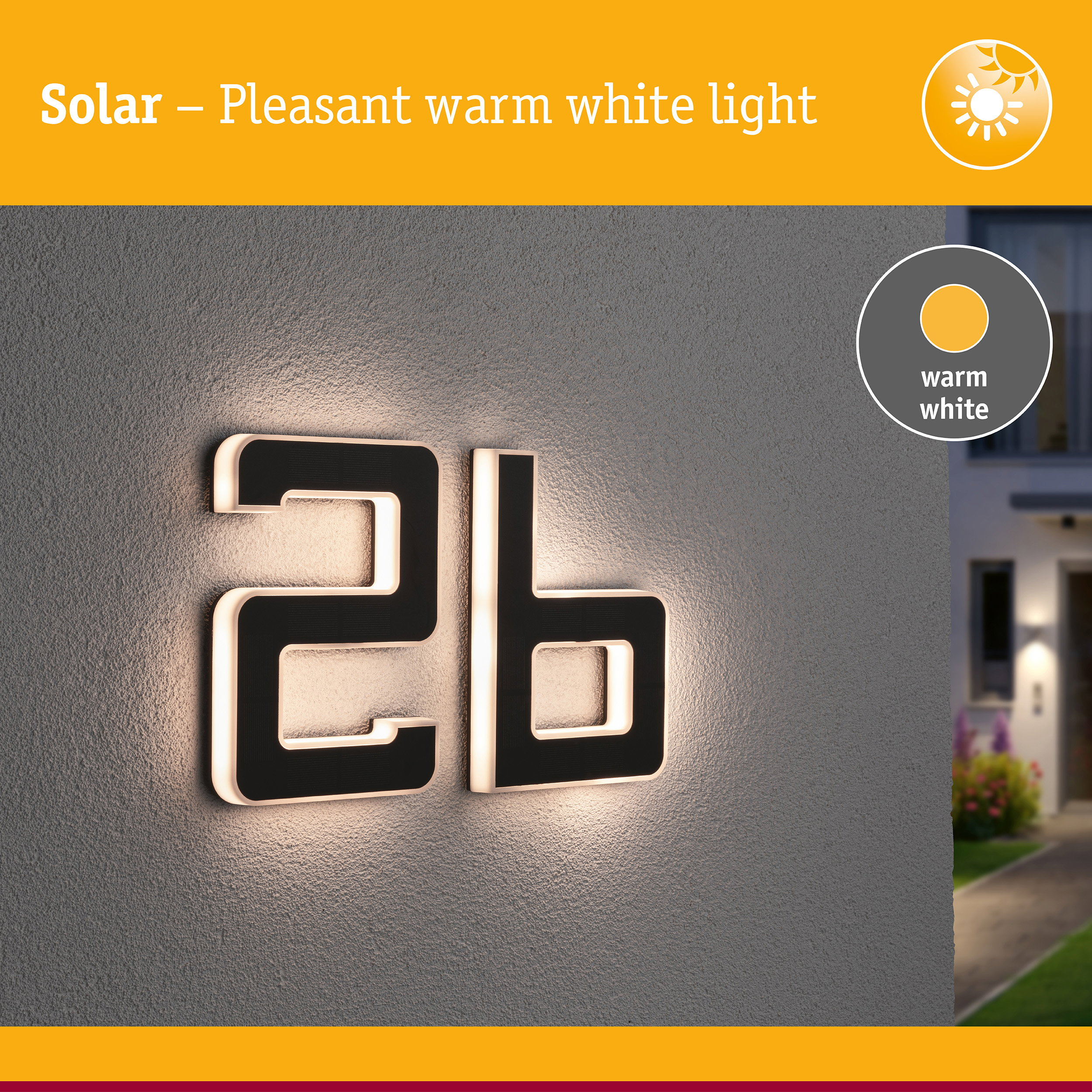 Solar-Hausnummer 2b leuchtet warmweiß an einer grauen Wand.