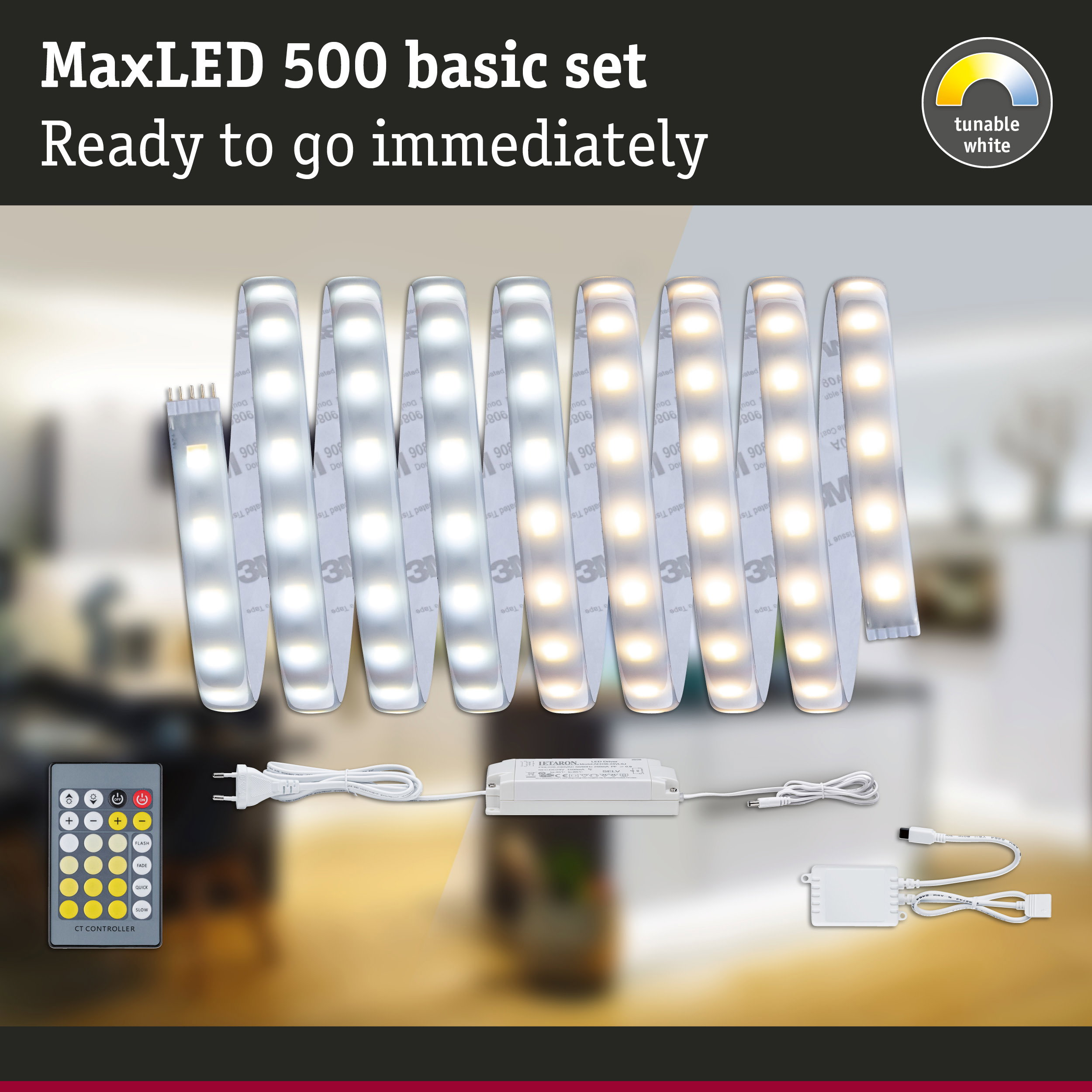 MaxLED 500 Basis-Set LED-Streifen mit Fernbedienung, Netzteil und Controller vor verschwommenem Raumhintergrund.