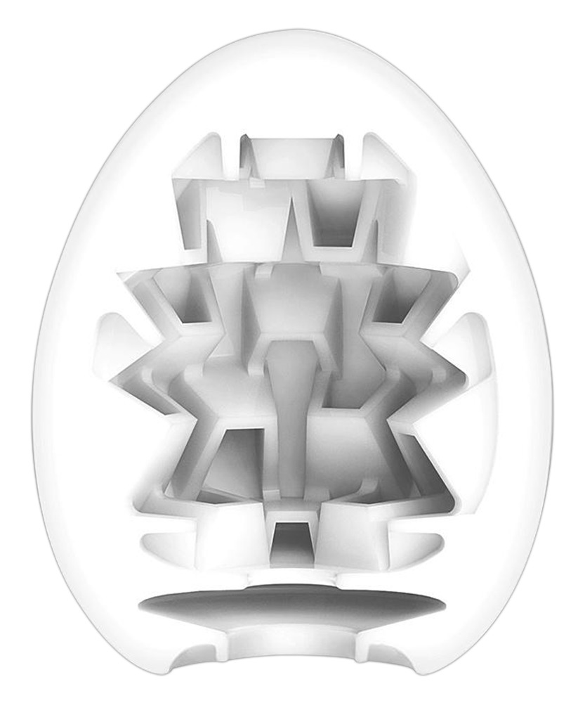 Ein weißes, oval geformtes Objekt mit einer komplexen, geometrischen Innenstruktur und Hohlkanälen.