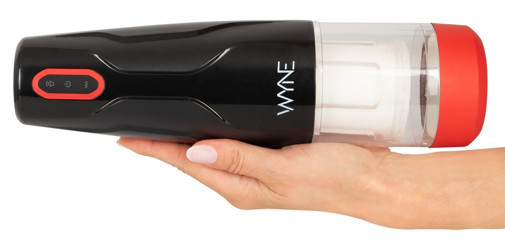 Eine Hand hält ein schwarzes und rotes elektronisches Wellness-Gerät.