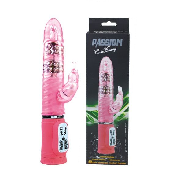 Dildo rosa transparente con cuentas de metal en el interior y caja a juego.