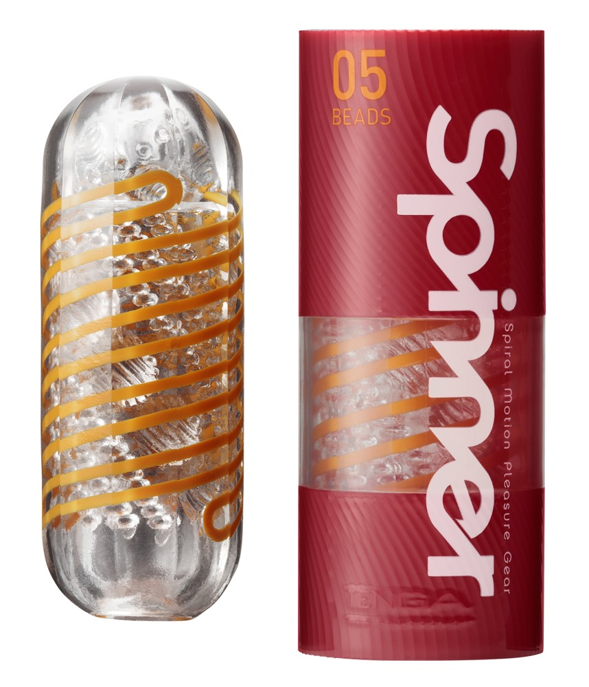 Ein Tenga Spinner 05 Beads Gerät neben der roten zylindrischen Verpackung.