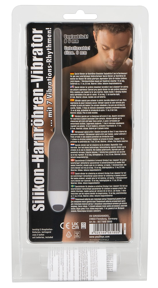 Verpackter grauer Silikon-Harnröhrenvibrator mit Produktbeschreibung und einem Männergesicht im Hintergrund.