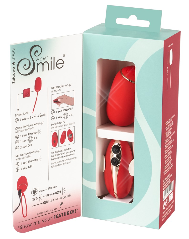 Offene türkise und rote Verpackung eines Sweet Smile roten Silikonvibrators mit Fernbedienung und Produktdetails.