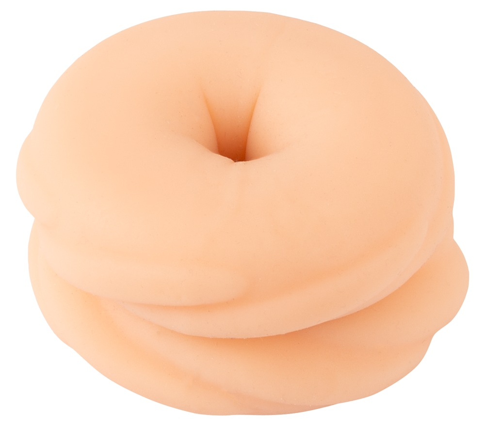 Ein fleischfarbenes, ringförmiges Wellnessobjekt auf weißem Hintergrund.