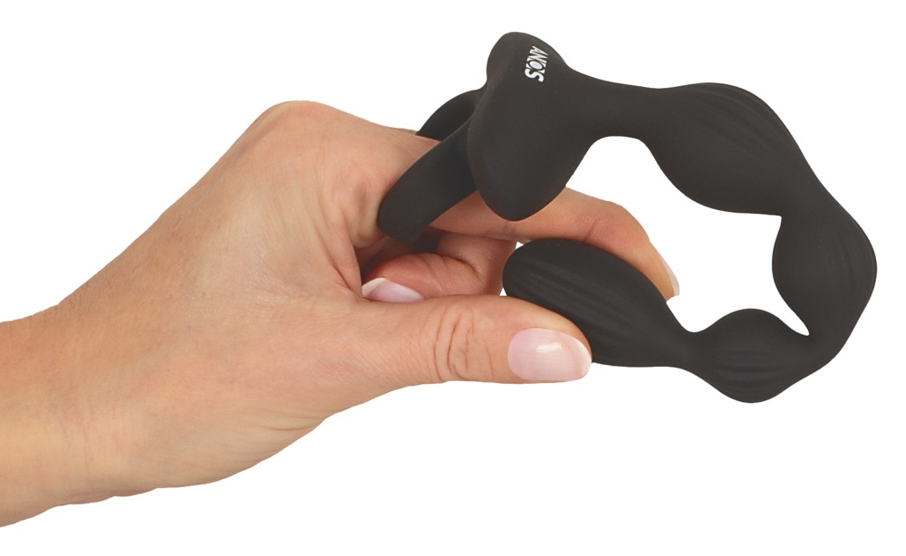 Eine Hand hält ein schwarzes, gewelltes Massagegerät aus Silikon.