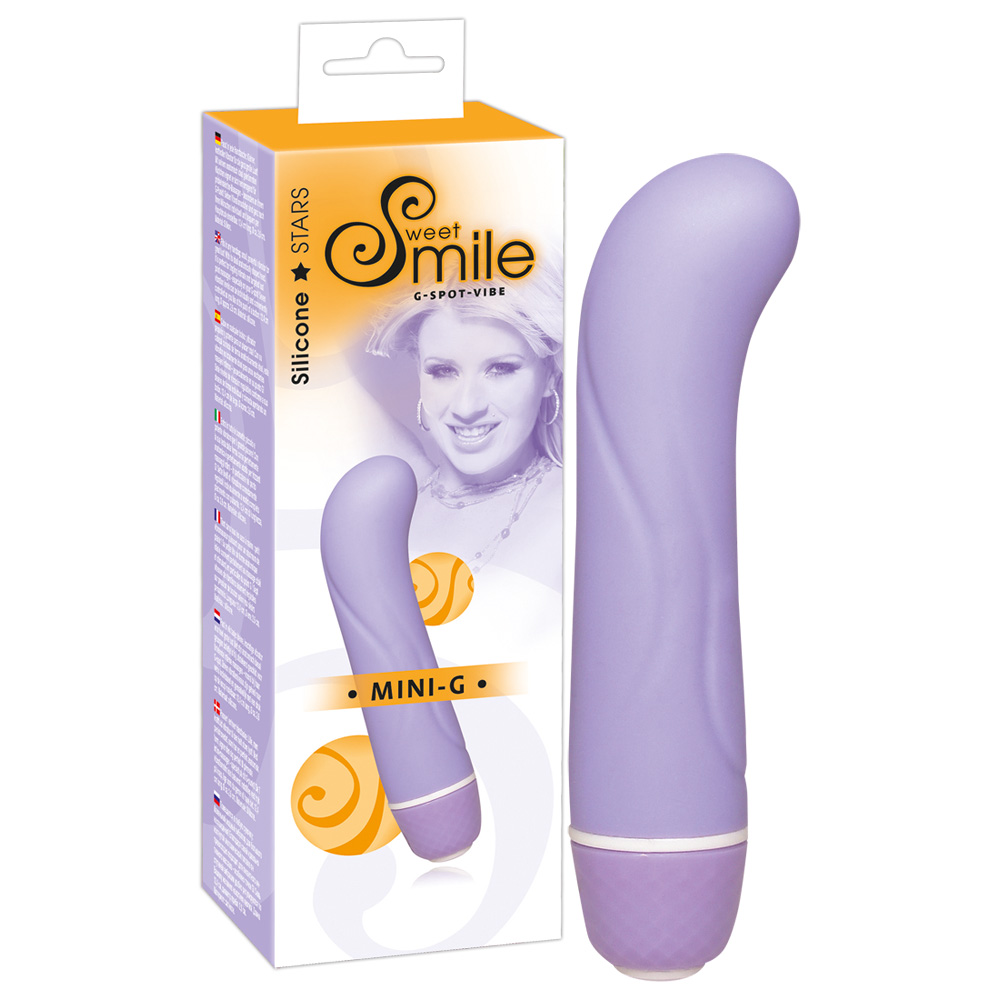 Lila Mini-G-Spot-Vibrator aus Silikon vor weiß-gelber Produktverpackung.