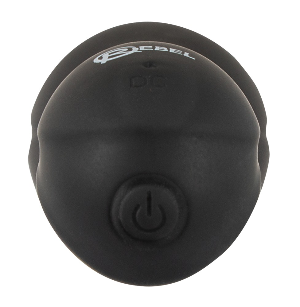 Ein schwarzer, runder Massageball mit Ein-Aus-Taste, Textlogo und Ladeanschluss vor schlichtem Hintergrund.