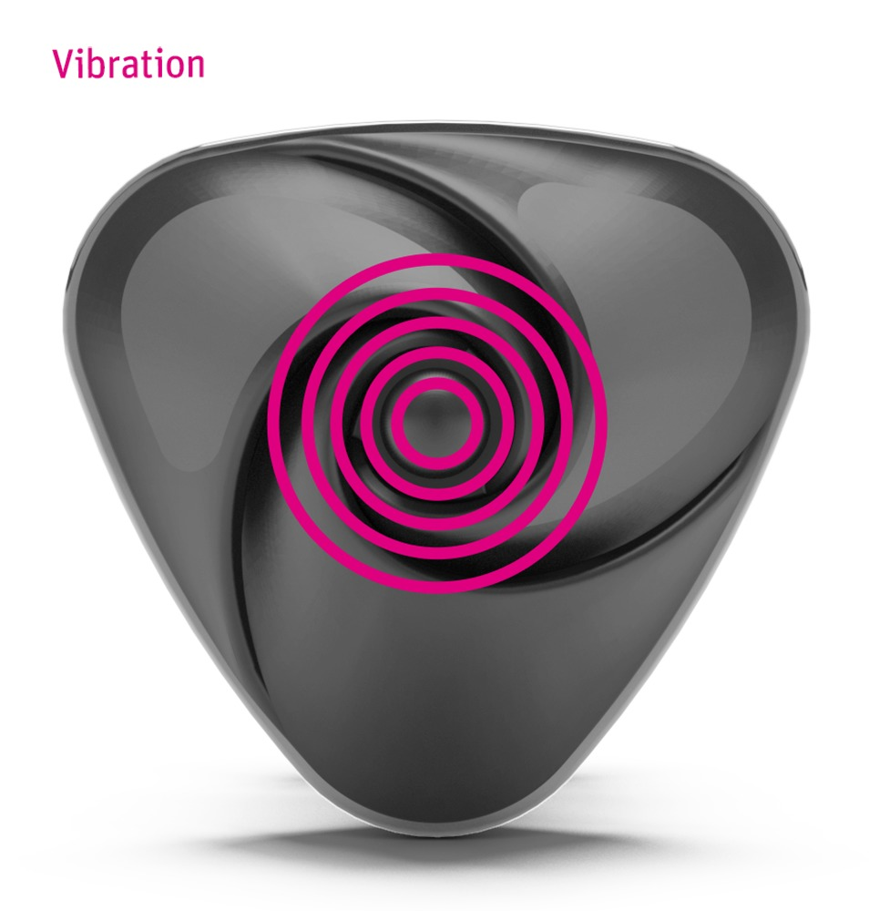 Ein graues, dreieckiges Gerät mit der Aufschrift Vibration und rosa konzentrischen Ringen in der Mitte.