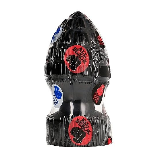 Ein schwarzes Plug-Spielzeug im Ananassaft-Design mit roten und blauen Aufklebern, verpackt in klarer Folie.