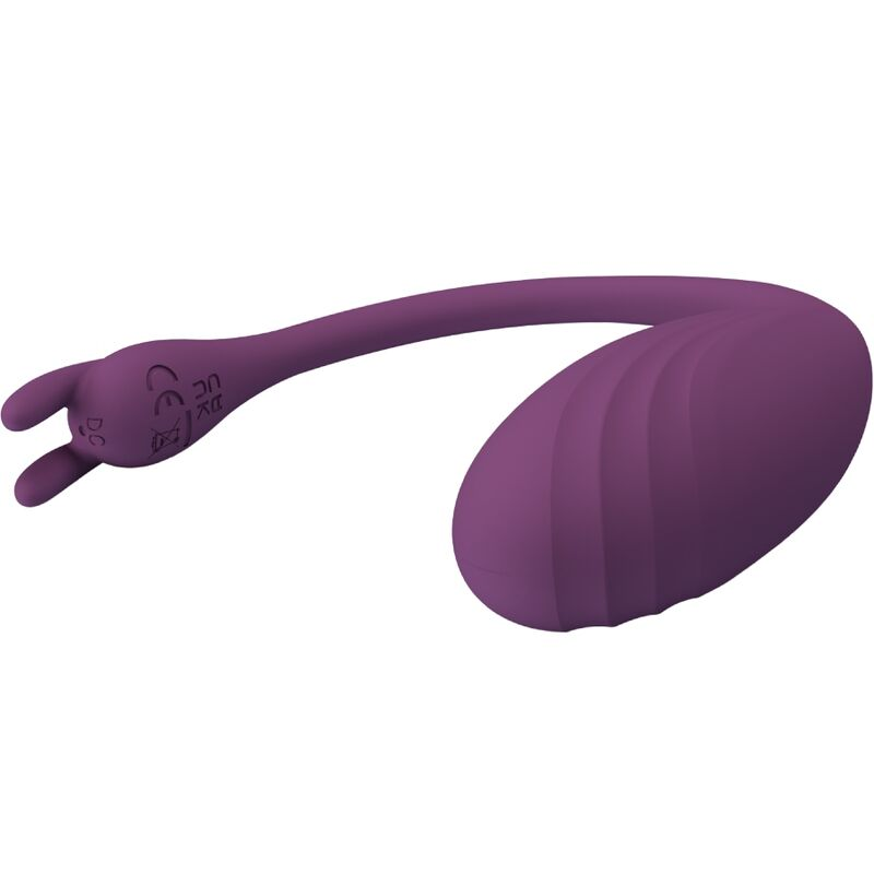 Dispositivo de bienestar de silicona morada con cuerpo ovalado estriado y tallo flexible con dos puntas.