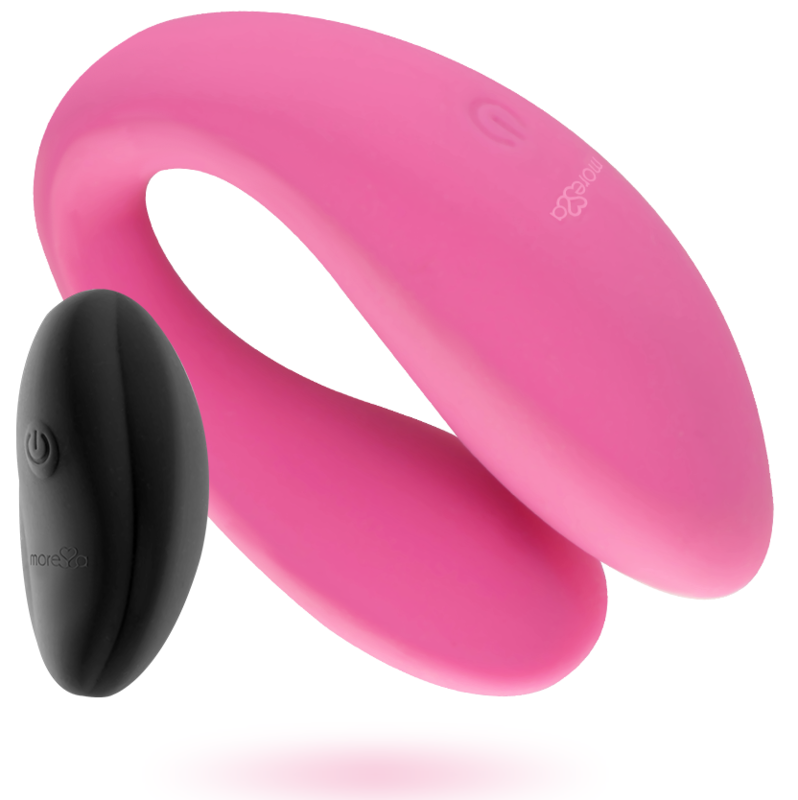 Ein geschwungenes pinkfarbenes Sexspielzeug und eine ovale schwarze Fernbedienung vor weißem Hintergrund.