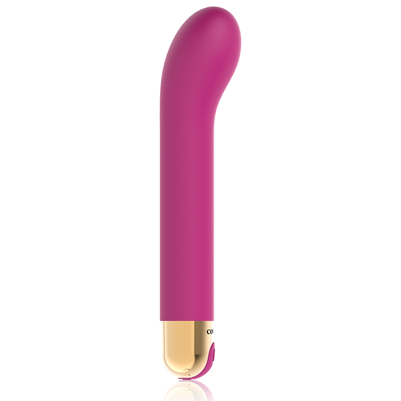 Un juguete para adultos curvo magenta con base dorada sobre fondo blanco.